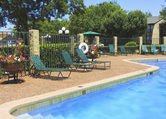 Alexis Park Apartments pool side view of gated pool in Shreveport