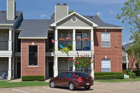 Champion Lake View Of Front Door and Porch In Front Of Apartment Building