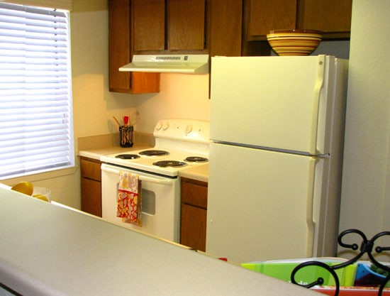 Pier Landing look inside beautiful model kitchen with wood cabinets and kitchen appliances