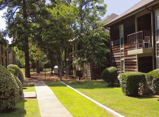 Aspen apartments backside view of apartment buildings in  courtyard