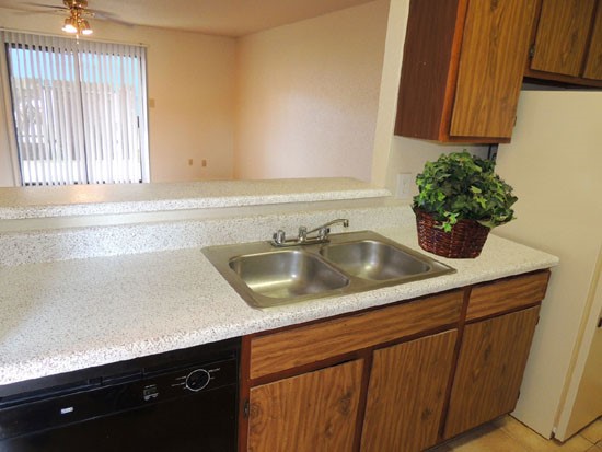 Cedar Creek Apartments Model Kitchen Looking Into the Open Living Room and Screen Doors