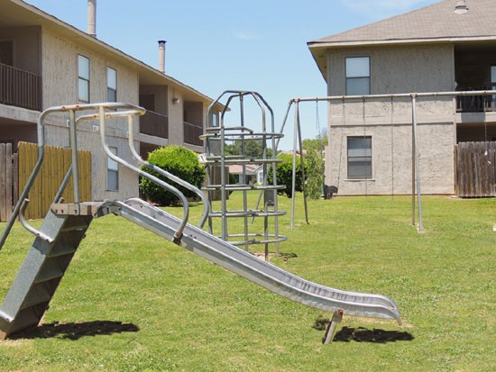 Cedar Creeks Playground with Money Bars and a Slide
