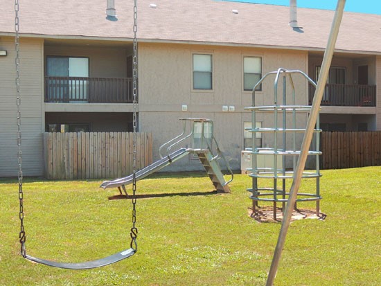 Cedar Creek Apartments Another view of Playground With Swing