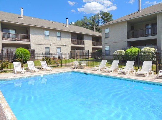 Cedar Creek Apartments Big Deep Pool with Pool Side Lounge Chairs