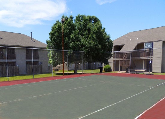 Cedar Creek Apartments Red and Grey Tennis Court, Shared as a Basketball Court