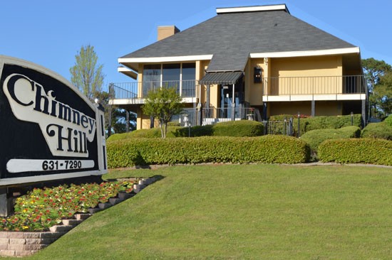 Chimney Hill Apartment Black and Tan Front Sign, in Front of Clubhouse