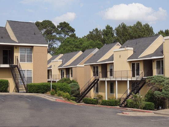 Chimney Hill Apartments View From Parking lot Looking To Front of Apartment Buildings, with Stairs Leading to Second Floor