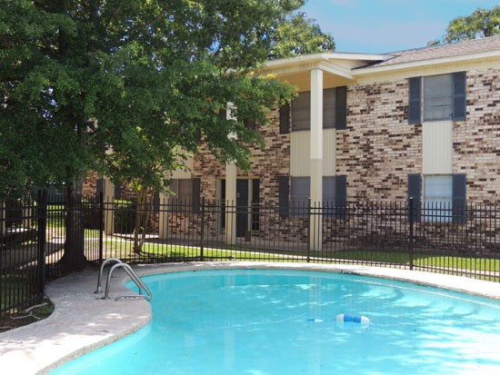 Colony Square Bean Shaped Pool with Apartment Buildings in Background