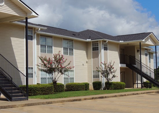 Fox Creek Apartments side view of apartment buildings with black straight stairs