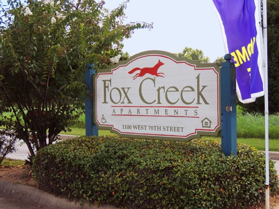 Fox Creek Apartments beautiful blue, white and gold front sign with red fox