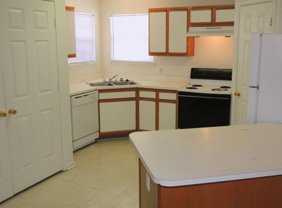 Fox Creek Apartments white and wood big open model kitchen