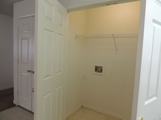 Fox Creek Apartments Laundry Room with space up above for storage
