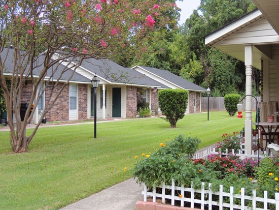 Heritage Village side view of courtyard with beautiful greenery