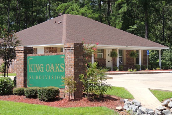 Kings Oaks big front sign with front office parking located behind sign