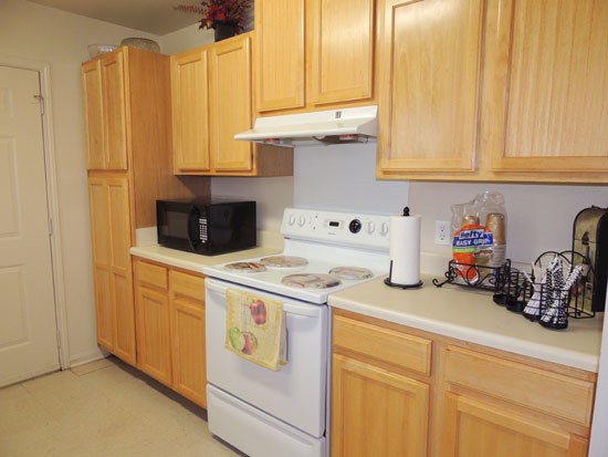 King Oaks Apartments beautiful light wood cabinets in model kitchen