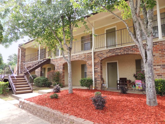 Kingston Village apartment buildings with lots of greenery