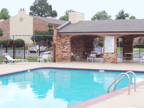 Kingston Village Apartments huge pool with entrance into pool area