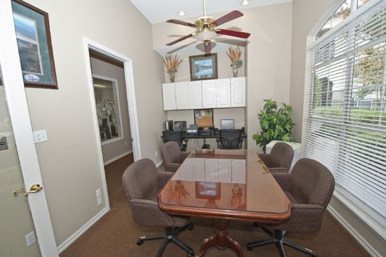 La Crosse conference/work room, with large table and chairs, two computers