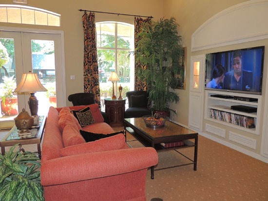 La Crosse Apartments living room area with tv and dvds interior of clubhouse