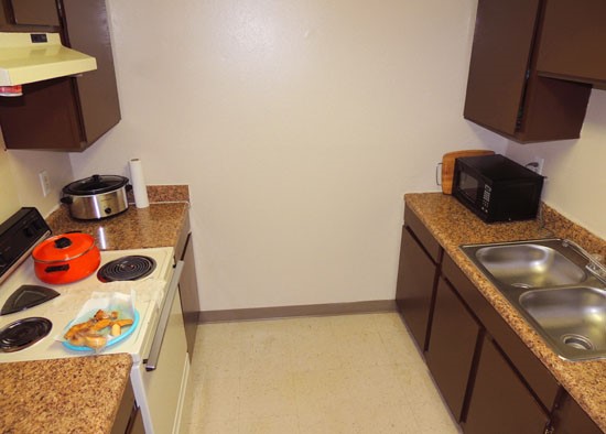 La Tierra beautiful dark wood cabinets with all kitchen appliances