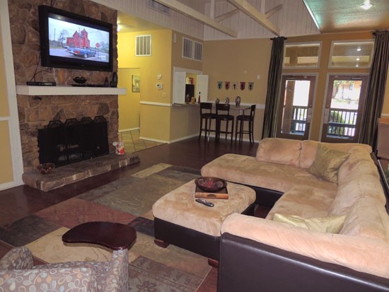 Riverbend Apartments living room area for residences with tv inside front office