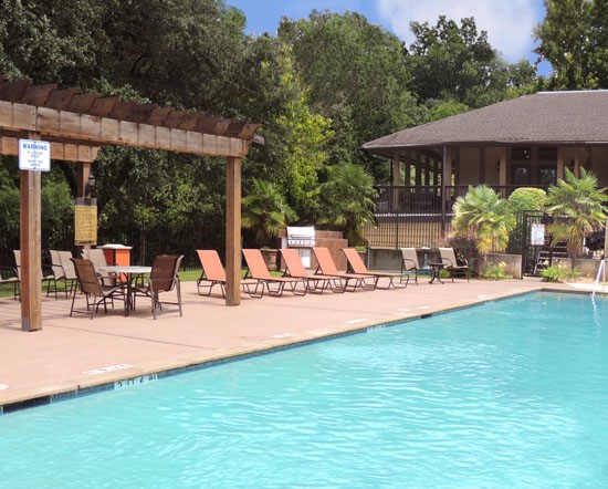 Riverbend pool side gazebo with pool side lounge chairs and tables