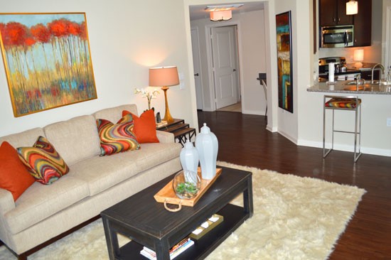Boulders on Fern model of huge living room looking into kitchen area