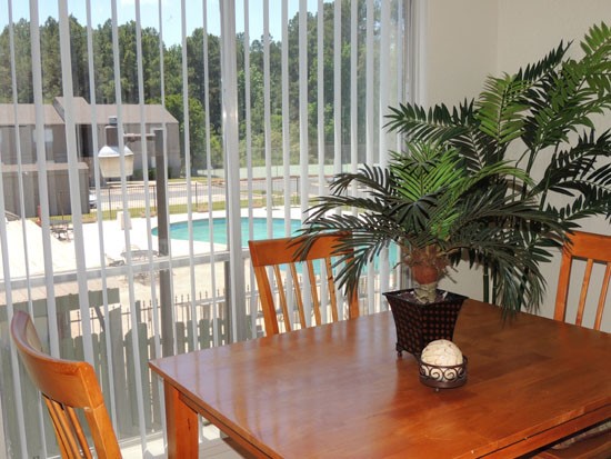 Tree Tops Apartments beautiful model dining room area, large sliding door, lots of light