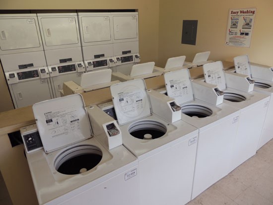 Villa Marquis interior of laundry facility with washer and dryers