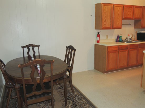 Villa Marquis Apartments open model dining room area, looking into kitchen