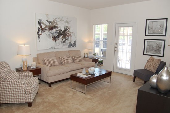 Westlake Apartments huge model living room with back door to porch